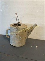 Rustic metal watering can