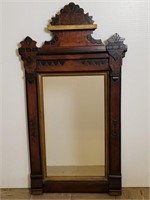 Antique carved wood wall mirror