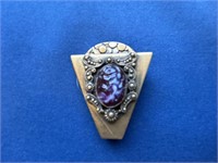 Ornate vintage brooch with stone