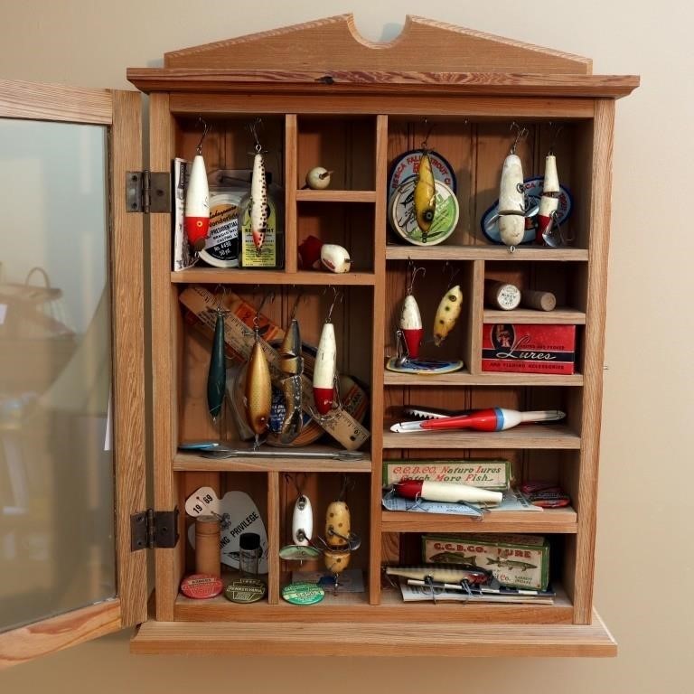 Lot of antique/vintage lures in a wall cabinet