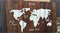 Reclaimed wood wall map of the world, painted on