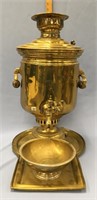 20.5" antique liquid dispenser with a spigot and a