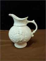 McCoy pottery pitcher has a chip