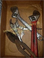 Large adjustable wrenches and tin snips