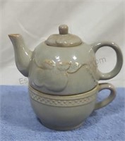 Ceramic Tea pot and cup combination.