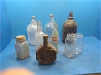 Tote of jugs, bottles, jars, and flasks