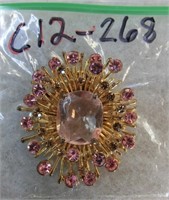 C12-268  starburst pin w/amethyst stones 2" dia.