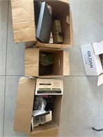 Three boxes of electronics and office supplies