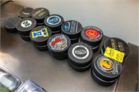 (22) Hockey Pucks, Various Teams