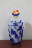 A Chinese Carved Overlay Peking Glass Snuff Bottle