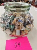 Vintage jar of thread spools