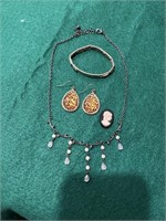 Black dangle necklace, gold expandable bracelet,