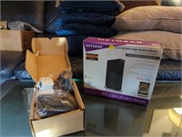 Two Netgear wifi cable modem routers