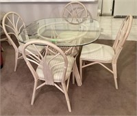 Rattan glass top table 4 chairs great shape