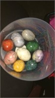 9 decorative marble eggs in jewel-tone colors.