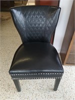 Leather Black Quilted Chair with nailhead accents.