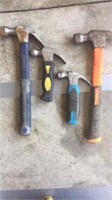 Four rubber handled hammers