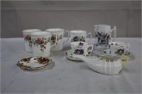 Four bone china mugs including Royal Albert,