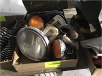 Box of used motorcycle lights, blinkers, 1960