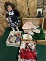 3 dolls with clothes and trunk