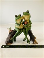 Painted frogs on a log decor