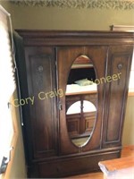 Oak wardrobe with oval mirror and carving, 47”W,17