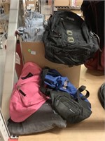 Jansport backpacks and box of assorted clothing
