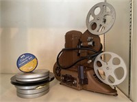 Antique Universal video projector, screen and reel