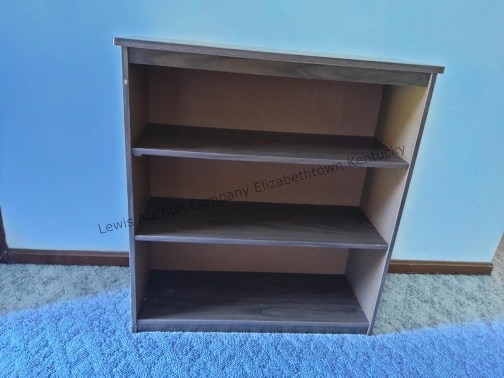 Brown three shelf bookcase