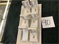 5 NECKLACE AND EARRING SETS ATTACHED TO DISPLAY