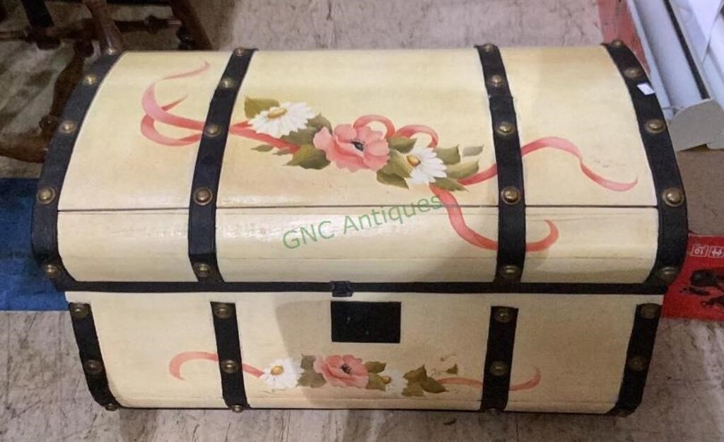 Wooden storage trunk with floral motif and