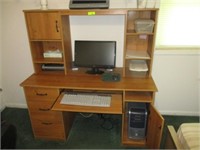 Computer desk and items on it