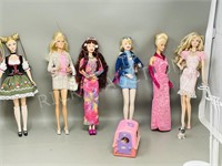 6 assorted Barbie dolls w/ stands