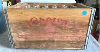 Antique crown beverages crate with glass bottles