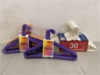 4 Packages Of Plastic Clothes Hangers