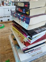 A stack of novels and other books