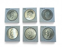 Six uncirculated Eisenhower Dollar coins in