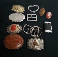 Belt buckles, bolo tie stones, and a lighter