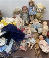 Box lot of dolls/toys doll cloths etc…