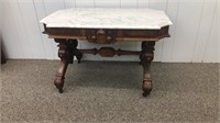 Victorian walnut coffee table with a marble top