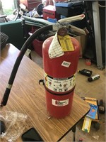 Charged fire extinguisher