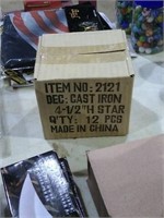 1 box of 12 small modern cast iron stars.