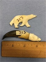 3 1/4" seal claw with an ivory carved polar bear h