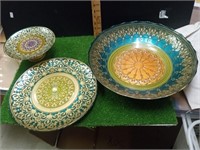 Three decorative bowls and plates.