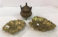 Lot includes two heavy metal gold tone ashtrays