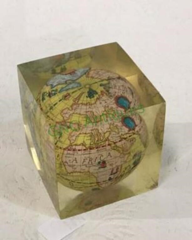 Vintage miniature world globe encased in acrylic