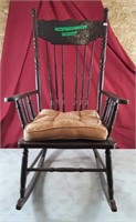 Wooden rocking chair with a cushion