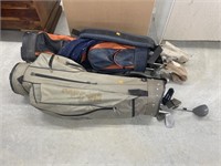 2 golf club bags w/ clubs