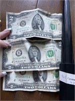 Three $2 bills