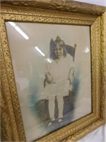 Framed photo of little girl, beautiful gold